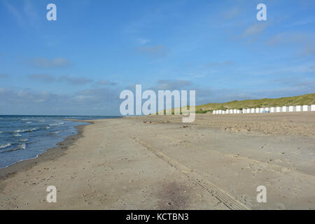 Beach cabins and  beach oat in the dunes on the North Sea coast, in the Netherlands on Zeeland Stock Photo