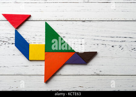 wooden tangram in an airplane shape Stock Photo
