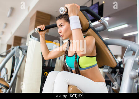 Doing Exercise at Gym Stock Photo