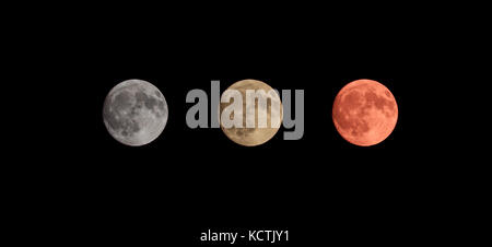 Three colors full moon on black sky background Stock Photo