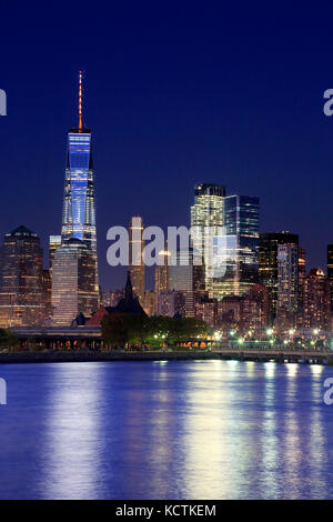 The night view of Lower Manhattan skyline with One World Trade Center tower in Financial Distric and Brooklyn.Manhattan,New York City,New York.USA Stock Photo