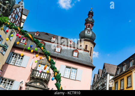 The town hall of Cochem in the Moselle Valley, Germany with some Easter egg decoration in the foreground. Stock Photo