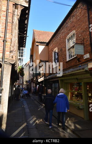 Narrow cobblestone street of shops, York Stock Photo