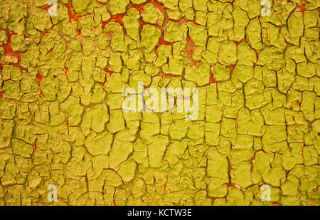 Yellow rusty metal grunge background with cracks. Texture shabby paint Stock Photo