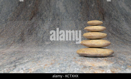 Zen stones stack from large to small in water with blue sky and