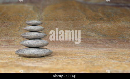 Zen stones stack from large to small in water with blue sky and