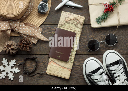 Table top view of ornaments and decorations Merry Christmas and Happy New Year with accessory travel concept background.Essential item on modern rusti Stock Photo