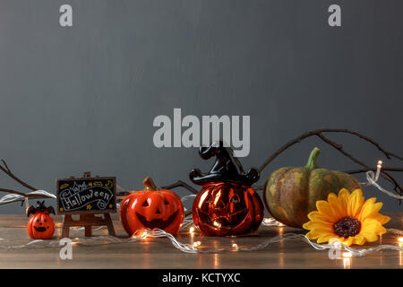 Accessory of Happy Halloween Festival concept.Essential decorations on the modern brown wooden home office desk background and copy space.pumpkins and Stock Photo