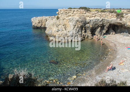 Rocky cove and blue Mediteranian sea on the Spanish island of Tabarca Stock Photo