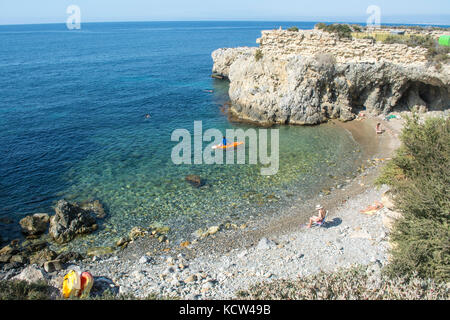 Rocky cove and blue Mediteranian sea on the Spanish island of Tabarca Stock Photo