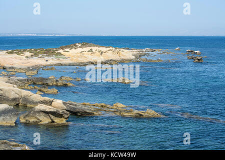 Rocky cove and blue Mediteranian sea on the Spanish island of Tabarca Stock Photo