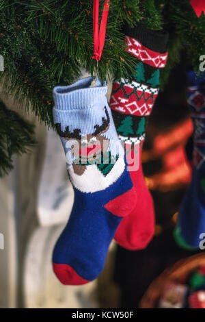 Christmas socks hanging in a Christmas tree Stock Photo
