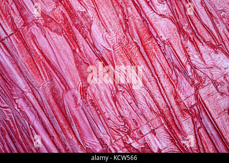 Red bumpy wall stucco texture background, crumpled leather imitation Stock Photo