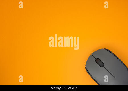 Wireless Computer Mouse On Yellow Background. Close up. Stock Photo