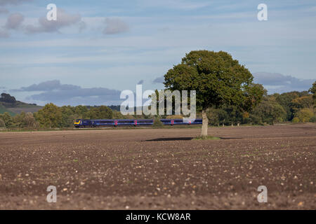 A First Great Western High speed train (Intercity 125) passes Beechingstoke (between Pewsey & Westbury)  with the 1506 London Paddington - Penzance Stock Photo