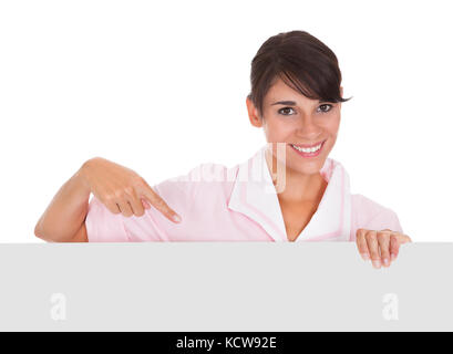 Young Happy Maid With Empty Bill Board Over White Background Stock Photo