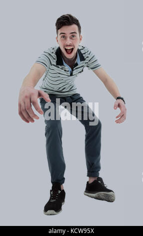 Young man celebrating his success over white background Stock Photo