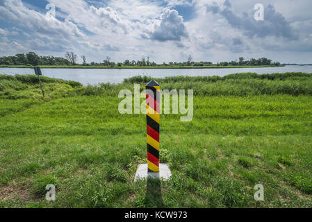 German boundary marker in Lower Oder Valley National Park in Brandenburg federal state in Germany Stock Photo