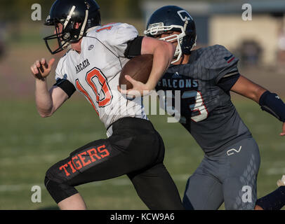 Football action with Arcata vs. Central Valley High School in  City of Shasta Lake, California. Stock Photo