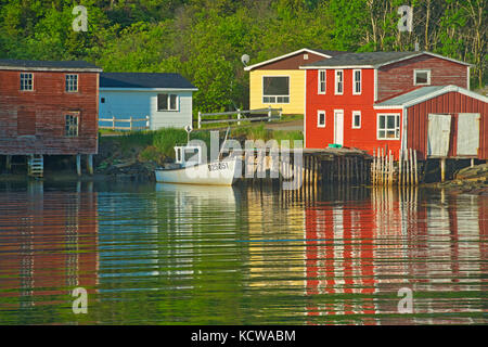 Reflection of village in Bonavista Bay, Salvage, Newfoundland & Labrador, Canada Stock Photo