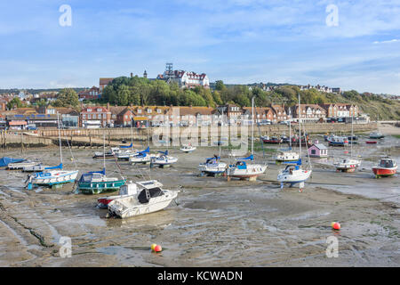 Fishing boats at low tide, Folkestone Harbour, Folkestone, Kent, England, United Kingdom Stock Photo