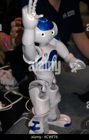 Nao, an autonomous, programmable humanoid robot, entertaining children at New Scientist Live 2017 Stock Photo