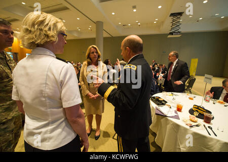 U.S. Army Maj. Gen. Robert E. Livingston Jr., the adjutant general for South Carolina speaks with Secretary of the Air Force Deborah Lee James during the SC Cyber symposium at Trident Technical College in North Charleston, S.C., May 6, 2016.(U.S. Air National Guard photo by Tech. Sgt. Jorge Intriago) Stock Photo