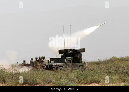 Florida National Guard Soldiers from the 265th Air Defense Artillery (ADA) fires a Man-portable Air Defense System, (ManPAD) during a live-fire exercise at a drone July 16, over the desert training area of Ft. Bliss, Tx. The ManPad is a shoulder-fired launcher that fires the Stinger missile at low-flying aircraft. The 265th ADA and the 188th ADA, from the North Dakota National Guard, spent several days preparing for the live firing and being evaluated and certified as part of preparation for an upcoming deployment. Soldiers The 263rd Army Air Missile Defense Company, S.C. National Guard, serve Stock Photo