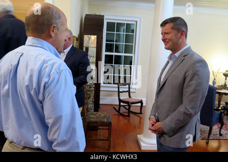 Under Secretary of the Army Mr. Patrick J. Murphy visits with U.S. Army Maj. Gen. Robert E. Livingston, Jr., the adjutant general for South Carolina at a reception in his honor during his visit to South Carolina in West Columbia, South Carolina, September 28, 2016. The Under Secretary was in the state to meet with Soldiers in the South Carolina Army National Guard, Fort Jackson, U.S. Army Central Command and cadets from the Citadel. (U.S. Army National Guard photo by Lt. Col. Cindi King) Stock Photo