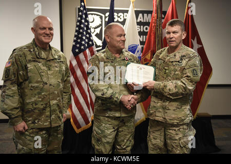 U.S. Army Lt. Gen. Jeffrey S. Buchanan, U.S. Army North (Fifth Army) commander, presents the Meritorious Service Medal to U.S. Army Lt. Col. Michael Davis during a visit to the 263rd Army Air and Missile Defense Command (AAMDC) in Anderson, South Carolina, Feb. 9, 2017. Davis was awarded for his performance as the Forward Air Defense coordination officer and liaison officer to U.S. Army North on behalf of the 263rd AAMDC.. (US Army National Guard Photo by Staff Sgt. Roby Di Giovine/Released) Stock Photo
