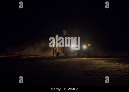 U.S. Army Soldiers from Scout Platoon, 4-118th Combined Arms Battalion, South Carolina Army National Guard conduct a night fire exercise with .50 calibur and M240 machine guns mounted on the M1114 Up-Armored Humvee at Fort Jackson, South Carolina Feb. 25, 2017 in preperation for annual training. During the exercise humvees roll out from a staging area behind the firing line. (National Guard Photo by Staff Sgt. Erica Knight, 108th Public Affairs Detachment)