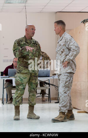 U.S. Army Brig. Gen. Brad Owens, South Carolina National Guard director of joint staff, briefs U.S. Marine Corps Maj. Gen. Carl E. Mundy, III, 5th Marine Expeditionary Brigade commander, about the Higher Control (HICON) operations for Eager Lion 16, May 21, 2016. Eager Lion 16 is a bilateral, scenario-based exercise with the Hashemite Kingdom of Jordan, designed to exchange military expertise and improve interoperability among partner nations. As part of Eager Lion 16, Owens is the HICON director and Coalition Forces Headquarters commander, and Mundy is the Combined Joint Task Force deputy com