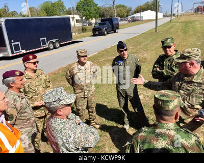 US Army Brig. Gen. John King, Director of the Joint Staff for the Georgia National Guard, speaks to members of the Colombian military at the Port of Savannah in Garden City, Ga., during a Civil Support Team Hazardous Material training scenario during Vigilant Guard, March 28, 2017. (U.S. Air National Guard photo by First Lt. Stephen Hudson) Stock Photo