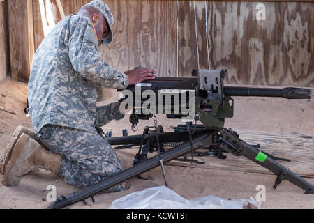 U.S. Army Spc. Thurman Trapp, 59th Troop Command, South Carolina Army National Guard, performs a functions check on the MK-19 Automatic Grenade Launcher, during the Best Warrior 2017 Competition at McCrady Training Center in Eastover, South Carolina, Jan. 29, 2017. The five-day event consisted of a road march, physical fitness test, and weapons qualification events, among others. Participants competed as individuals with an enlisted and non-commissioned officer winner being announced Feb. 1, 2017. (U.S. Army National Guard photo by Sgt. Brian Calhoun, 108th Public Affairs Det.) Stock Photo