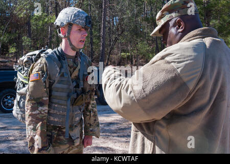 U.S. Army Spc. James Ouzts, 263rd Army Air and Missile Defense Command, South Carolina Army National Guard, recites the Soldier's Creed after completing the 12-mile foot march portion of the Best Warrior 2017 Competition at McCrady Training Center in Eastover, South Carolina, Jan. 29, 2017. The five-day event consisted of a road march, physical fitness test, and weapons qualification events, among others. Participants competed as individuals with an enlisted and non-commissioned officer winner being announced Feb. 1, 2017. (U.S. Army National Guard photo by Sgt. Brian Calhoun, 108th Public Aff Stock Photo