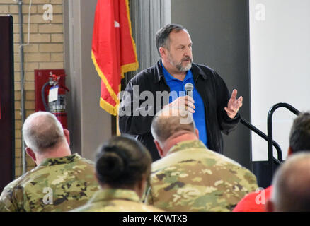 Mr. Kenneth Braddock, state operations chief of staff, speaks to the crowd of more than 150 Soldiers, Airmen, and civilians gathered at the Bluff Road armory in Columbia, South Carolina for a Town Hall meeting Mar. 1, 2017, to address concerns and discuss the way ahead for the South Carolina Military Department. (U.S. Army National Guard photo by Capt. Jessica Donnelly) Stock Photo