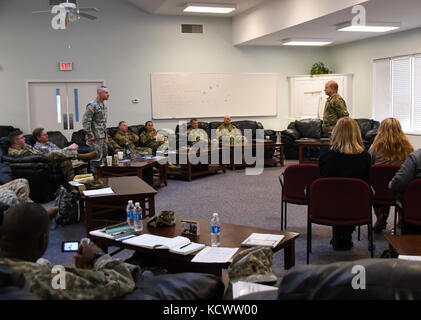 Chaplain (Maj.) Ronald Thompson, South Carolina National Guard, asks U.S. Army Maj. Gen. Robert E. Livingston, Jr., the adjutant general for South Carolina, a question concerning prayer during a 2-day training session for chaplains throughout the state at McCrady Training Center in Eastover, South Carolina March 3. The annual training, held March 3 – 4, focused on updating chaplain skills and learning how to approach old challenges in new ways. (U.S. Army National Guard photo by Sgt. Tashera Pravato/108th PAD) Stock Photo