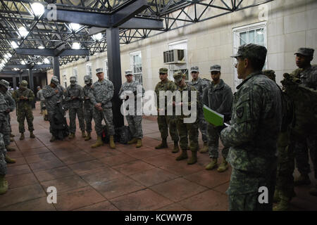 Soldiers with the South Carolina National Guard receive an early morning briefing before heading downtown to support the 58th Presidential Inauguration Jan. 20, 2017, in the District of Columbia. Approximately 30 Soldiers from the South Carolina National Guard joined the more than 7,500 citizen-Soldiers and Airmen from about 40 states and territories in the Nation's capital to provide support for the 58th Presidential Inauguration in the District of Columbia, Jan. 20, 2017. The support of the National Guard, including South Carolina, is at the request of the local civilian authorities, as well Stock Photo