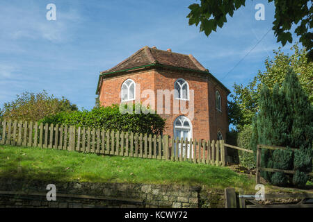 The round house in the pretty village of Albury in Surrey, UK Stock Photo