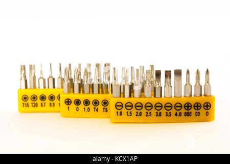 Set of screwdrivers bits isolated on white background. Stock Photo