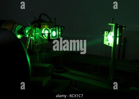 Powerful industrial green laser equipment in a laboratory for physics research. Solid State Physics lab. Light amplification by stimulated emission of Stock Photo