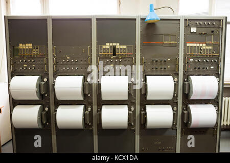 Seismographs recording earthquakes on the sheet of measuring paper. Seismological device for measuring earthquakes. Seismograph machine needle drawing Stock Photo