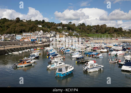 View over boats moored in The Cobb and the old town behind, Lyme Regis, Dorset, England, United Kingdom, Europe Stock Photo