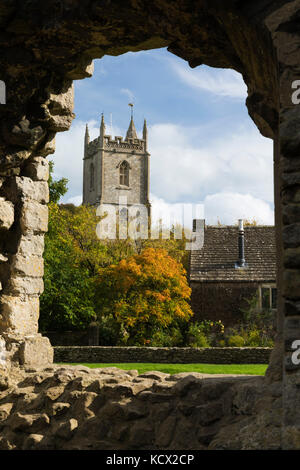 All Saint's Church viewed through window of ruined Nunney Castle, Nunney, near Frome, Somerset, England, United Kingdom, Europe Stock Photo