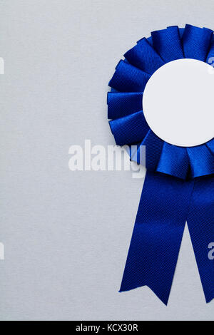 First place award rosette with blank white centre.  Success achievement concept Stock Photo