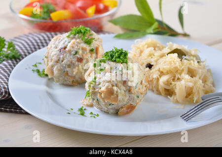 Homemade South Tyrolean bacon dumplings with sauerkraut Stock Photo