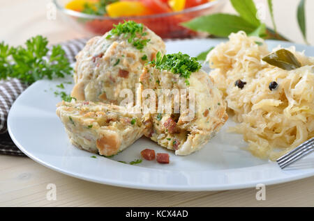 Homemade South Tyrolean bacon dumplings with sauerkraut Stock Photo