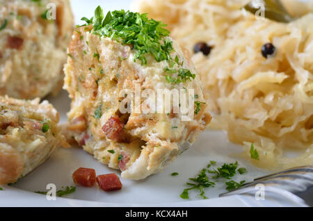 Homemade South Tyrolean bacon dumplings with sauerkraut Stock Photo