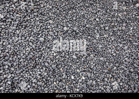 Volcanic dark grey background, stones, soil Stock Photo