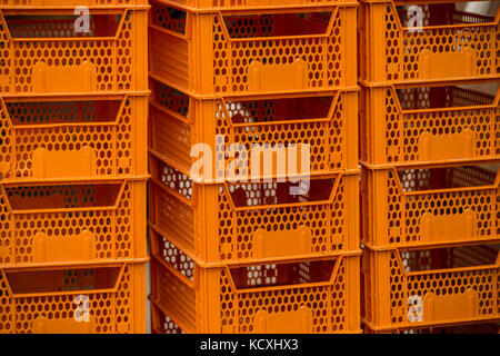 Stack of crates for groceries on a market Stock Photo